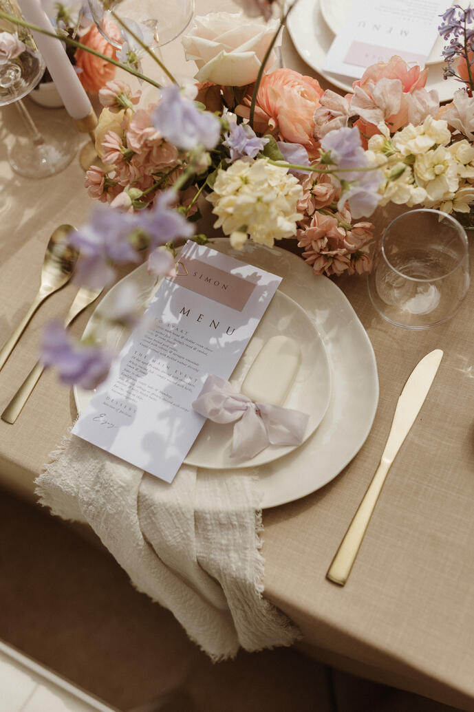 White plate with gold cutlery, personalised menu and cake pop at Woodhill hall White plate with gold cutlery, personalised menu and cake pop at Woodhill hall